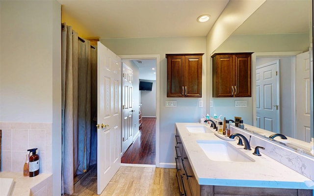 395 Toleman Rd, Washingtonville, NY 12575 - bathroom with wood finished floors, double vanity, baseboards, and recessed lighting