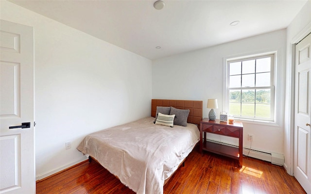 395 Toleman Rd, Washingtonville, NY 12575 - bedroom with wood finished floors, a baseboard radiator, and baseboards