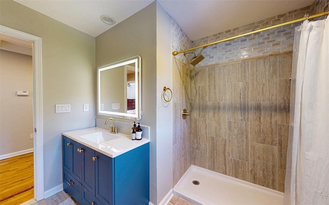 395 Toleman Rd, Washingtonville, NY 12575 - full bath with vanity, a tile shower, and baseboards
