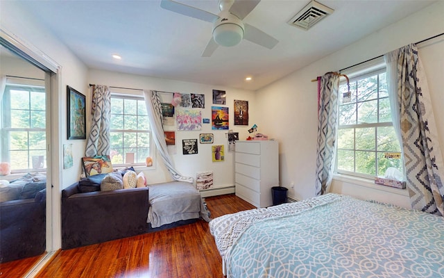 395 Toleman Rd, Washingtonville, NY 12575 - bedroom with a baseboard heating unit, wood finished floors, a ceiling fan, and recessed lighting