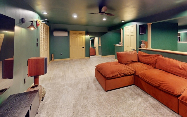 395 Toleman Rd, Washingtonville, NY 12575 - cinema featuring a ceiling fan, a wall unit AC, recessed lighting, baseboards, and wood finished floors