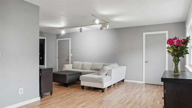109 Doxbury Ln, Suffern, NY 10901 - living area with light wood-style flooring, baseboards, and track lighting