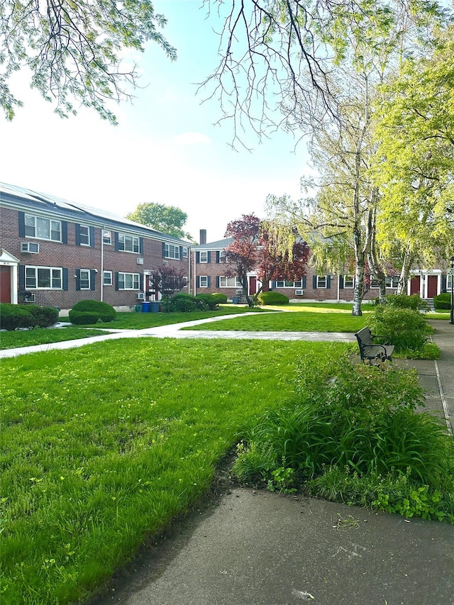 152-45 Jewel Ave Unit 160A, Flushing, NY 11367 - surrounding community featuring a lawn