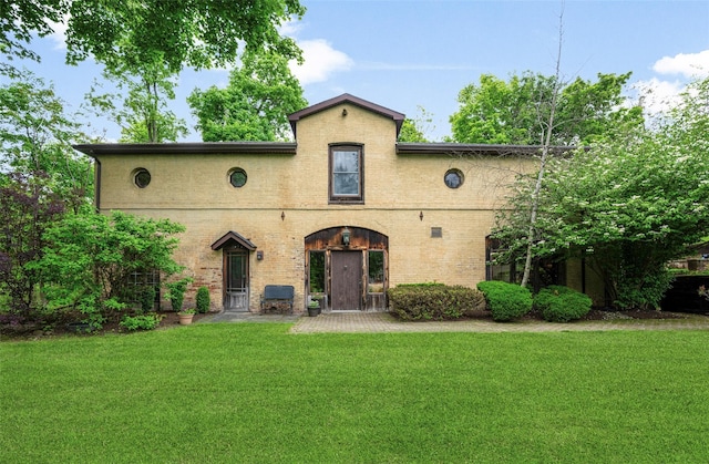 66 Susan Dr, Newburgh, NY 12550 - mediterranean / spanish-style house featuring a front lawn and brick siding