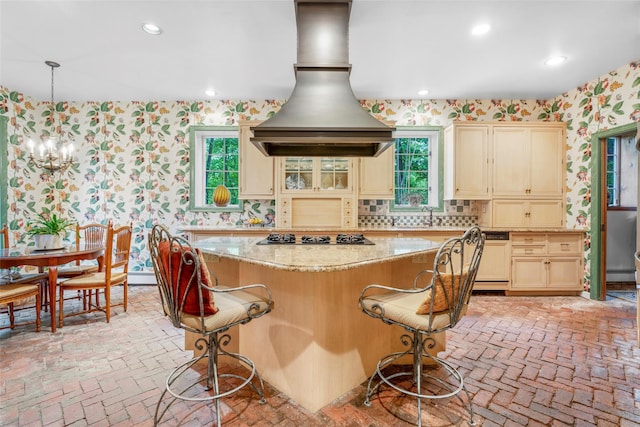 66 Susan Dr, Newburgh, NY 12550 - kitchen with wallpapered walls, dishwasher, brick floors, gas cooktop, and custom exhaust hood