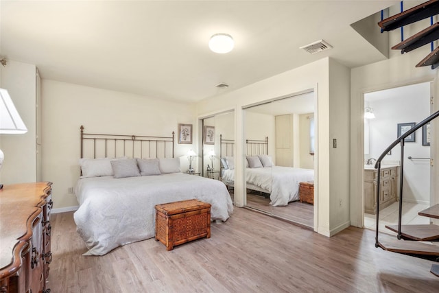 66 Susan Dr, Newburgh, NY 12550 - bedroom with wood finished floors, baseboards, and multiple closets