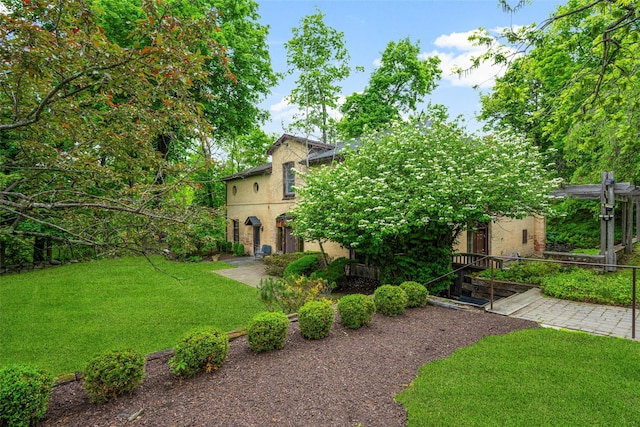 66 Susan Dr, Newburgh, NY 12550 - obstructed view of property featuring a front lawn and stucco siding