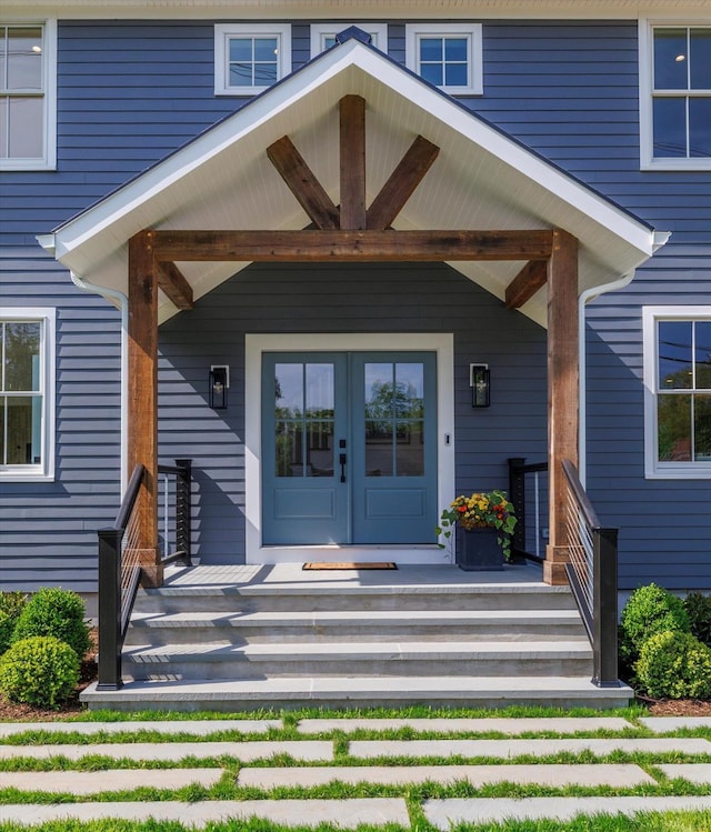 480 Ackerly Pond Ln, Southold, NY 11971 - doorway to property featuring covered porch and french doors