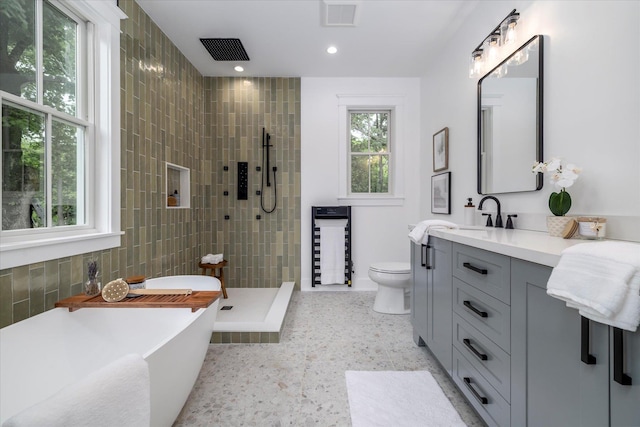 480 Ackerly Pond Ln, Southold, NY 11971 - full bathroom featuring vanity, a tile shower, a soaking tub, toilet, and recessed lighting