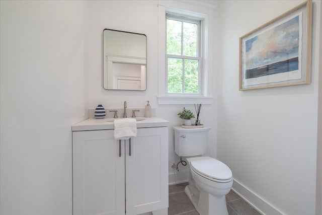 480 Ackerly Pond Ln, Southold, NY 11971 - bathroom featuring tile patterned flooring, vanity, toilet, and baseboards