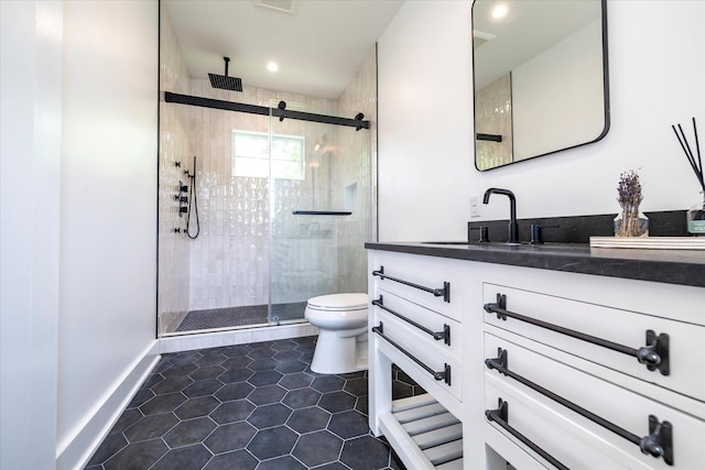 480 Ackerly Pond Ln, Southold, NY 11971 - full bath with toilet, vanity, a shower stall, tile patterned floors, and baseboards