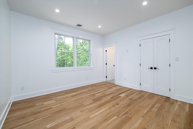 480 Ackerly Pond Ln, Southold, NY 11971 - unfurnished bedroom with light wood-style flooring, baseboards, and recessed lighting