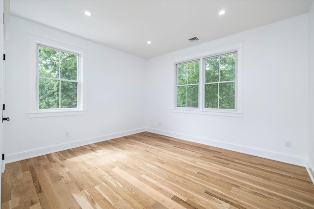 480 Ackerly Pond Ln, Southold, NY 11971 - empty room featuring healthy amount of natural light, light wood-style floors, baseboards, and recessed lighting