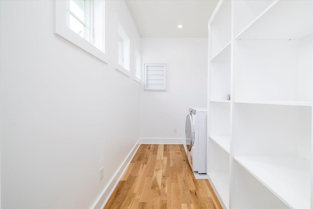 480 Ackerly Pond Ln, Southold, NY 11971 - laundry area with independent washer and dryer, light wood finished floors, baseboards, and recessed lighting