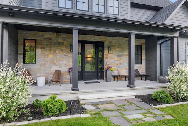 36 Spruce Ln, Poughkeepsie, NY 12603 - doorway to property featuring a porch, stone siding, and roof with shingles