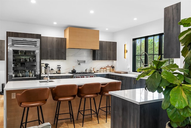 36 Spruce Ln, Poughkeepsie, NY 12603 - kitchen featuring light countertops, stainless steel gas cooktop, modern cabinets, recessed lighting, and tasteful backsplash