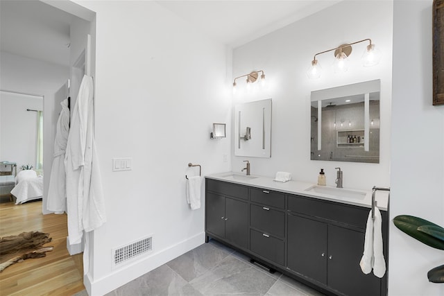 36 Spruce Ln, Poughkeepsie, NY 12603 - full bath featuring baseboards, connected bathroom, and double vanity