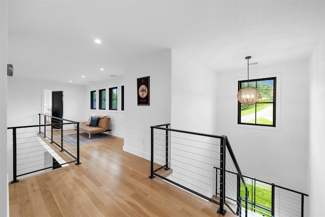36 Spruce Ln, Poughkeepsie, NY 12603 - corridor featuring an upstairs landing, a chandelier, wood finished floors, recessed lighting, and baseboards