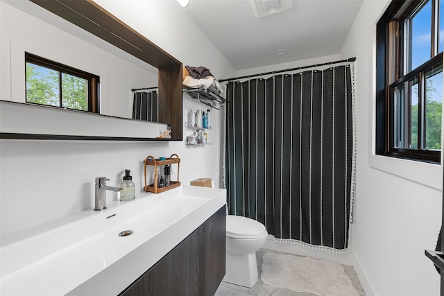 36 Spruce Ln, Poughkeepsie, NY 12603 - full bathroom with toilet, vanity, and a shower with curtain