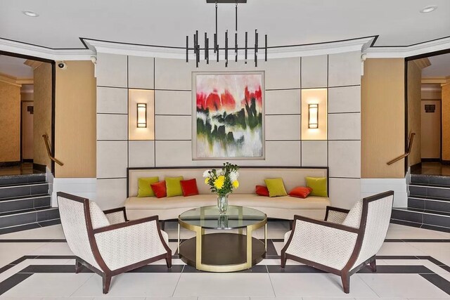 100-11 67th Rd Unit 416, Forest Hills, NY 11375 - building lobby with crown molding, stairway, and recessed lighting