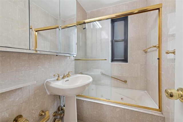 100-11 67th Rd Unit 416, Forest Hills, NY 11375 - full bathroom with a combined bath / shower with jetted tub, tile walls, and tasteful backsplash