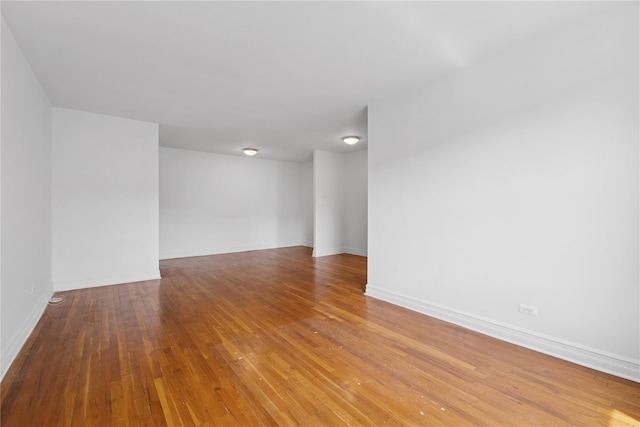 100-11 67th Rd Unit 416, Forest Hills, NY 11375 - spare room featuring wood finished floors and baseboards