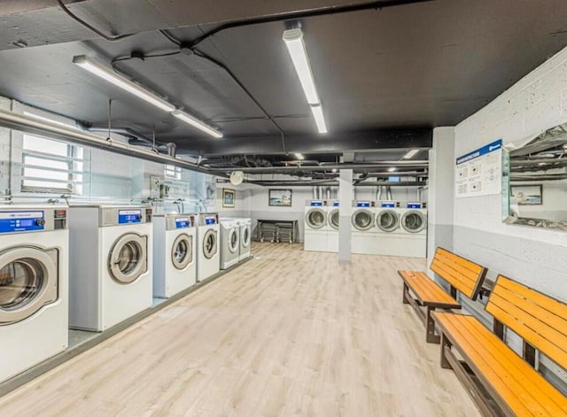 210 Pelham Rd Unit 6H, New Rochelle, NY 10805 - shared laundry featuring washing machine and clothes dryer and wood finished floors