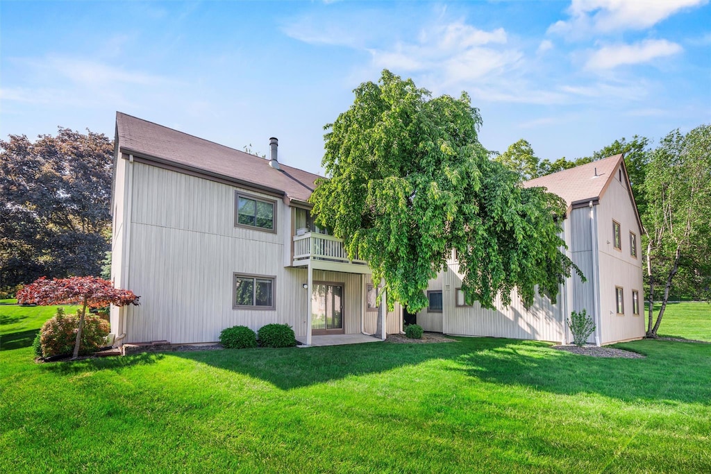 39 Sycamore Dr, Middletown, NY 10940 - back of house with a lawn, a balcony, and roof with shingles