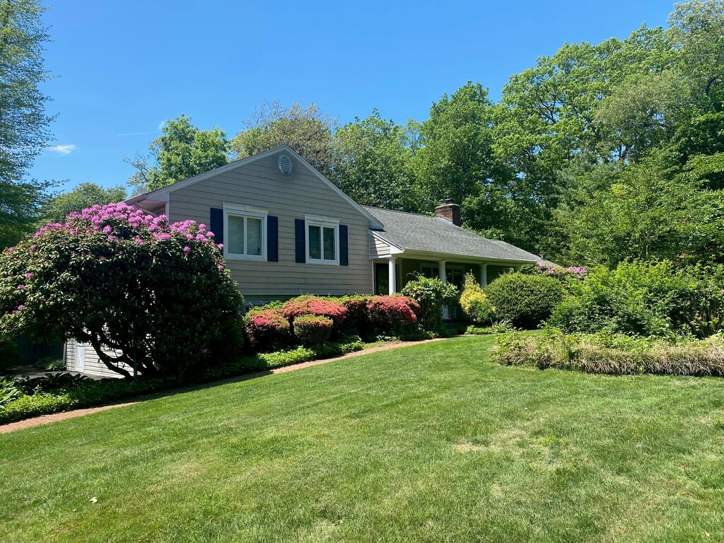 36 Oriole Way, Dix Hills, NY 11746 - view of front of home featuring a front lawn and a chimney