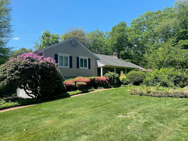 36 Oriole Way, Dix Hills, NY 11746 - view of front of home featuring a front lawn and a chimney