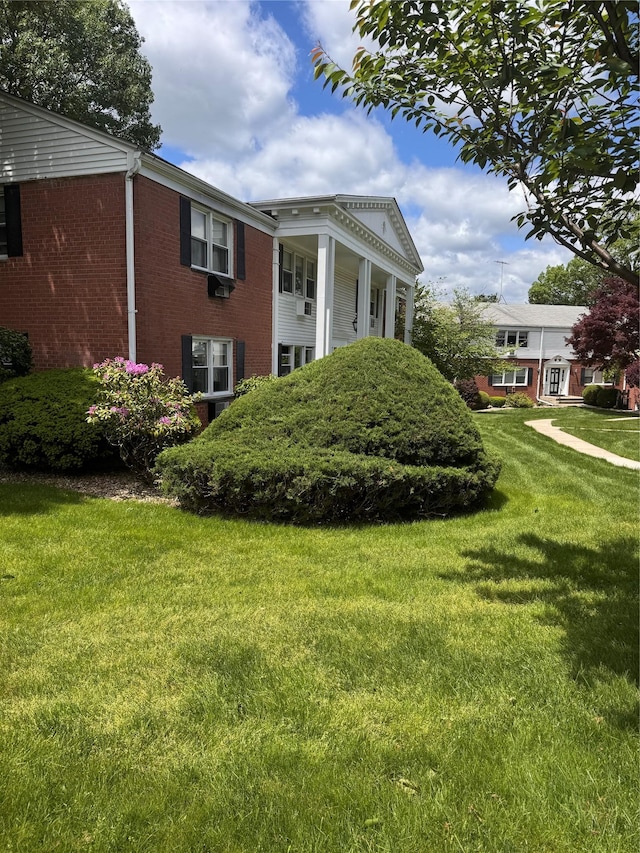 35 Bon Aire Cir Unit 8113, Suffern, NY 10901 - view of property exterior with brick siding and a yard