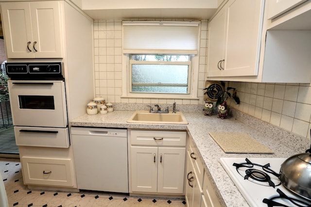 35 Bon Aire Cir Unit 8113, Suffern, NY 10901 - kitchen featuring white appliances, a sink, a warming drawer, light countertops, and white cabinetry
