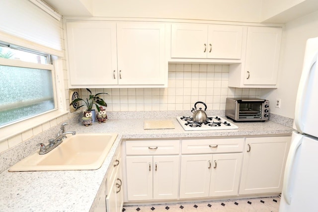 35 Bon Aire Cir Unit 8113, Suffern, NY 10901 - kitchen featuring white appliances, a sink, white cabinets, and light countertops