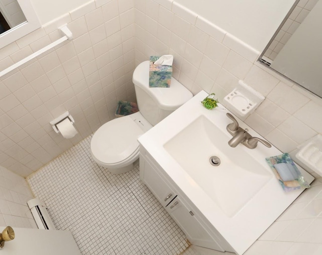 35 Bon Aire Cir Unit 8113, Suffern, NY 10901 - half bathroom featuring tile walls, tile patterned flooring, toilet, and a baseboard heating unit