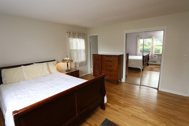 35 Bon Aire Cir Unit 8113, Suffern, NY 10901 - bedroom featuring light wood-style floors, a closet, baseboard heating, and baseboards