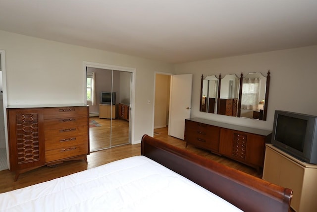 35 Bon Aire Cir Unit 8113, Suffern, NY 10901 - bedroom featuring a closet, wood finished floors, and a baseboard radiator