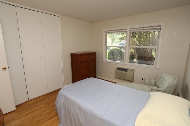 35 Bon Aire Cir Unit 8113, Suffern, NY 10901 - bedroom with a wall mounted air conditioner, light wood-style flooring, and a closet