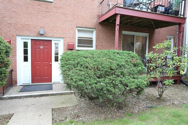 35 Bon Aire Cir Unit 8113, Suffern, NY 10901 - doorway to property featuring a balcony and brick siding