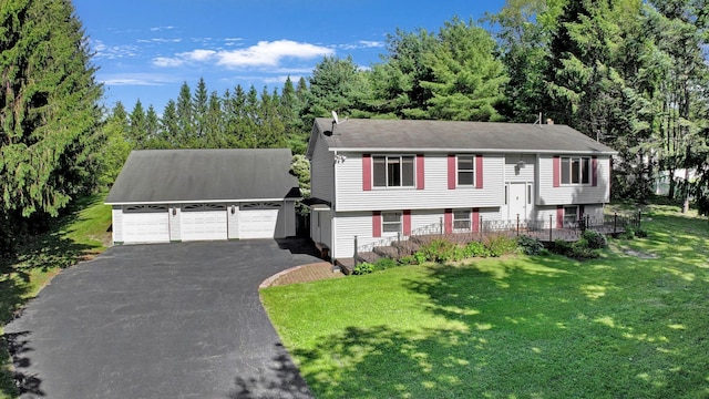 232 County Route 49, Slate Hill, NY 10973 - bi-level home featuring a front yard, a detached garage, and an outbuilding
