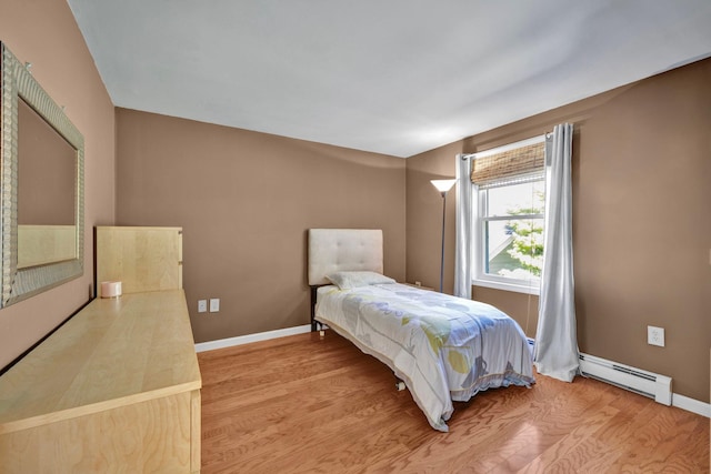 232 County Route 49, Slate Hill, NY 10973 - bedroom with baseboard heating, light wood finished floors, and baseboards