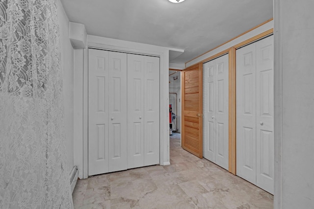 232 County Route 49, Slate Hill, NY 10973 - unfurnished bedroom with multiple closets and light marble finish flooring