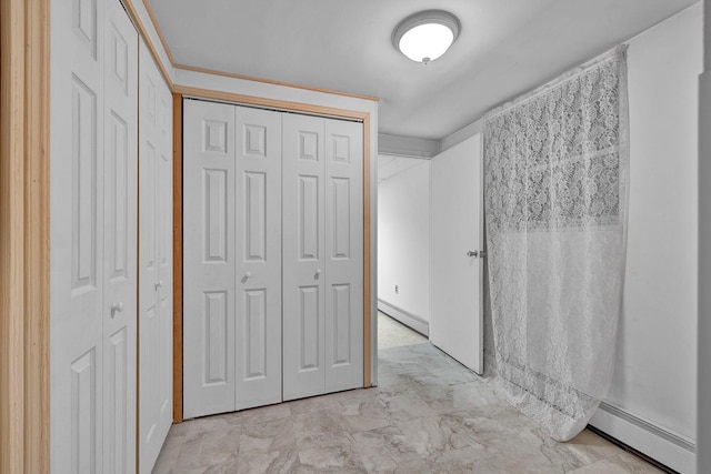 232 County Route 49, Slate Hill, NY 10973 - unfurnished bedroom with baseboard heating, a closet, and light marble finish floors