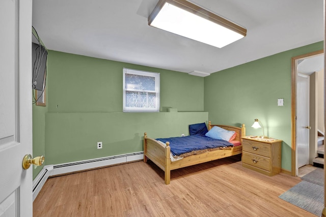232 County Route 49, Slate Hill, NY 10973 - bedroom with wood finished floors, baseboards, and baseboard heating