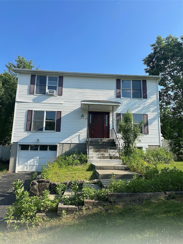 4 Kyle Ct, Carmel, NY 10512 - view of front of house with an attached garage and asphalt driveway