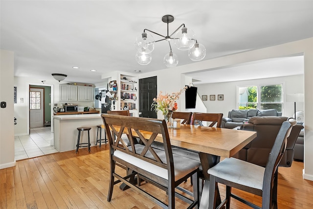 4 Kyle Ct, Carmel, NY 10512 - dining space with light wood-type flooring, a chandelier, recessed lighting, and baseboards