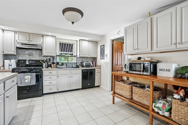 4 Kyle Ct, Carmel, NY 10512 - kitchen with black appliances, light countertops, tasteful backsplash, under cabinet range hood, and a sink