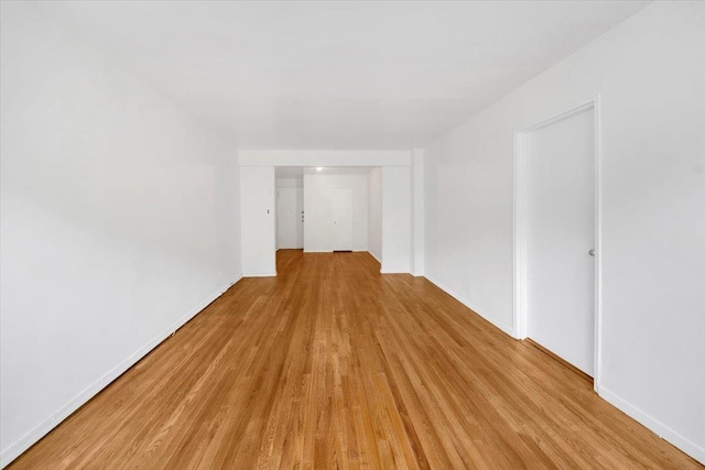 4320 E Van Cortlandt Park E Unit 5E, Bronx, NY 10470 - spare room featuring light wood-type flooring and baseboards
