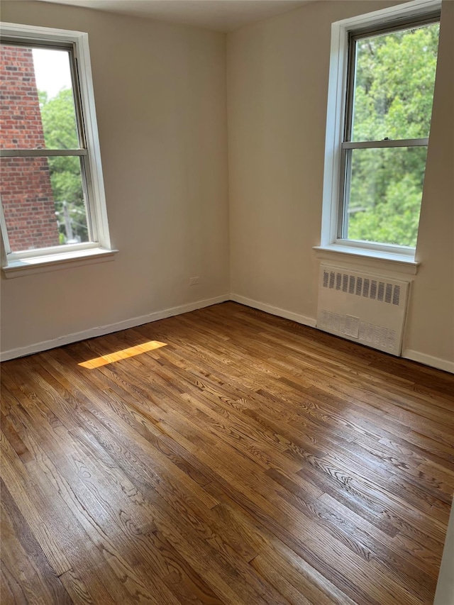 4320 E Van Cortlandt Park E Unit 5E, Bronx, NY 10470 - spare room with radiator and wood finished floors