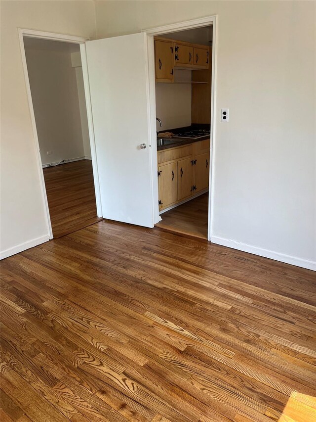 4320 E Van Cortlandt Park E Unit 5E, Bronx, NY 10470 - unfurnished bedroom with dark wood-type flooring and baseboards