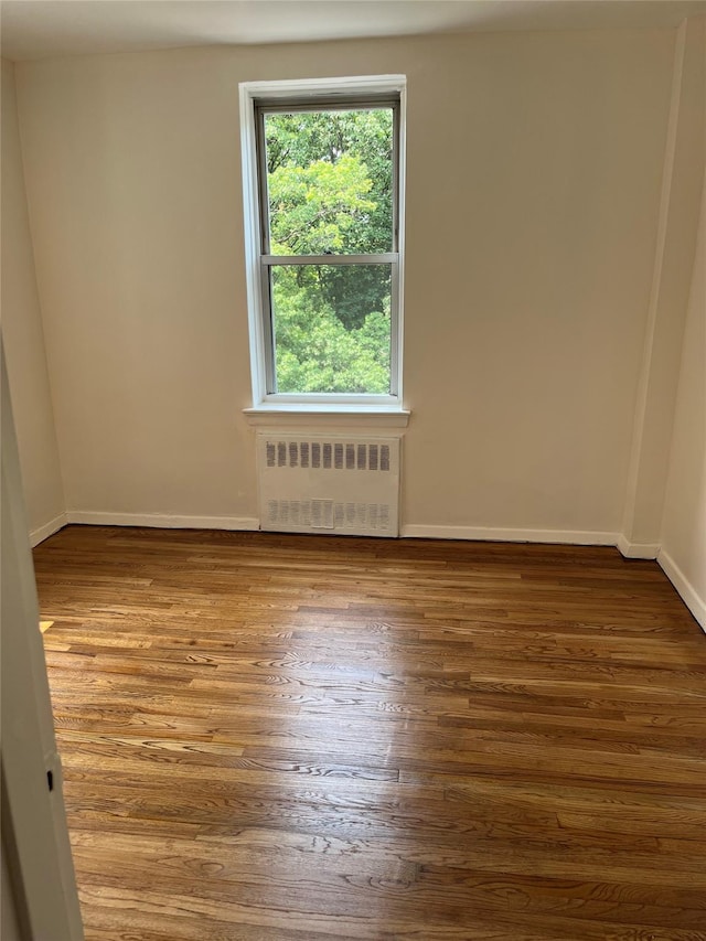 4320 E Van Cortlandt Park E Unit 5E, Bronx, NY 10470 - unfurnished room with radiator heating unit and wood finished floors